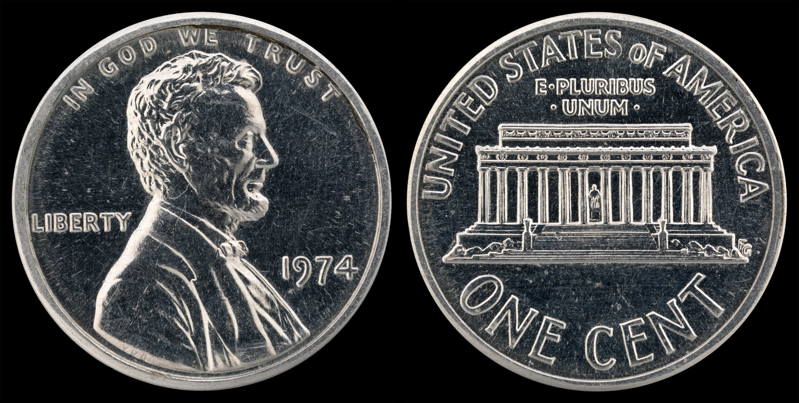 1974 aluminum Lincoln cent trial strike — silvery aluminum cent showing Lincoln's portrait on the obverse and the Lincoln Memorial on the reverse